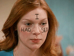 Donna from That 70's Show with 'I Had Sex' written on her face because she lost her virginity, in her case from straight sex and not lesbian or queer sex.